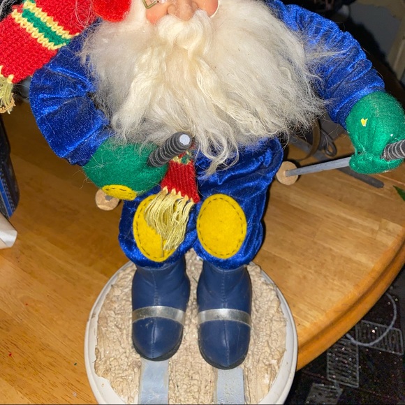 Skiing Santa plush doll like statue on wooden base. - Picture 2 of 3